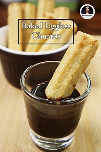 Baked eggless churros are a delightful variation of traditional churros that are typically fried. For the Churros: - 1 cup (110g) Maida (all-purpose flour) - 1/4 cup (31.2g) Milk Powder - 40g Mawa (khoya) - 1 cup (250ml) Water - 1/8 tsp (0.6g) Baking Soda - 1/2 tsp (2.4g) Baking Powder - 1/4 cup (50g) Salted Butter - 1.5 tbsp (18g) Brown Sugar - 2 Cardamom Pods (seeds removed and crushed) For Serving: - Chocolate Sauce / Sugar syrup Instructions: 1. Preheat your oven to 180°C (350°F) and line a 
