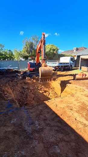 Watching the bucket carve out the space for endless poolside memories is so satisfying! | GV Unique Pools & Landscaping