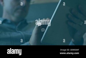 Mid-adult man tapping tablet screen in tech demo on sofa, generating chat bubbles tracking messages. Technology, communication, digital, innovation, entertainment, relaxation, modern Stock Video Footage - Alamy