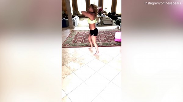 Britney Spears practices energetic dance moves at home