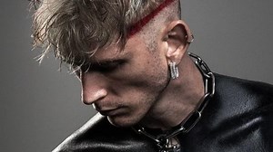 Machine Gun Kelly unveils full-body ‘blackout’ tattoos