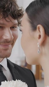 Newlyweds look at each other in church. Action. Beautiful couple of newlyweds look into their eyes with love. Newlyweds in love at ceremony
