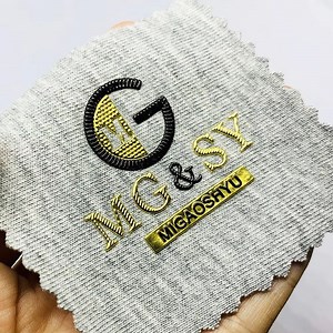 [Hot Item] Iron on Custom Logo Gold Metallic Printing 3D Embossed TPU Labels Patches for Sports Wear