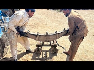 Suspension truck leaf spring restoration process at workshop |