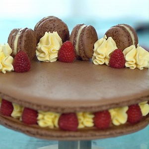 Macaron Cake - a giant chocolate macaron filled with a sweetened condensed milk buttercream and flavorful raspberry jam. #macaroncake | Home Cooking Adventure