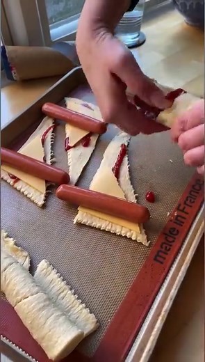 These Hot Dog Roll-Ups with crescent rolls are fun and easy to make and SO GOOD! We love them for a quick lunch or dinner. Visit ThriftyJinxy.com for the full recipe. #easyrecipes #hotdogs #lunchideas #crescentrolls | Thrifty Jinxy