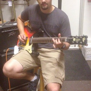 Matt showing off a '66 Mosrite we have for sale ! $4150 Fender Ramarte tube amp $300 www.DeMontGuitars.com #fender #mosrite #tubeamp #guitar #vintageguitar #ventures #guitarsale #vintage #demont #demontguitars #chicago | DeMont Guitars