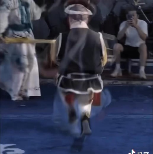 In Chinese opera, "#Dwarf Skill" actors maintain a semi-squat position throughout, mimicking the movements of short characters. With their unique posture, they skillfully bring these vibrant figures to life on stage! #culture #opera | ShanghaiEye