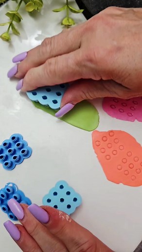 Tiny flowers 💐 for tiny books. 📚 Did you know I make petal cutters 5mm small as well as tiny book cutters? Do you like making miniatures? Video of small polymer clay flowers being placed on miniature clay books made using polymer clay cutters by blessed Beach Girl co | Kyleen Kiger Smith