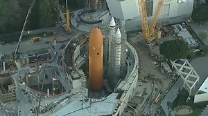 Endeavour lifted for installation in upright display at Science Center