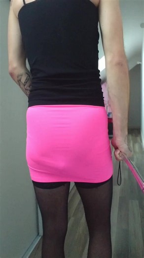 Lexiie is walking around in a pink skirt with her poop