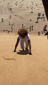 Angela climbing a sand dune in the Namibian desert. Namibia Africa #Angela #Namibia #namibiandesert #sanddunes #angelaweekes #wife | Taj Weekes