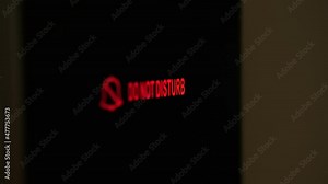 do not disturb. close-up. the sign is lit in red. electronic plate. a digital board with an inscription - do not disturb, in the hotel room. female finger presses the button.