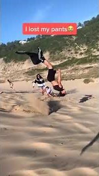 Guy's Pants Come Off While He Backflips At Beach Repeatedly - 1160606