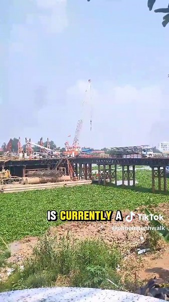 The Chak Angre Krom - Prek Pra Bridge is a vital infrastructure project currently under construction over the Bassac River in Phnom Penh, Cambodia. Designed as a twin concrete bridge, it will span a total length of 1,650 meters, with the bridge itself measuring 845.70 meters long and 27 meters wide. The approach roads, extending 804.30 meters, will maintain the same width. The construction is expected to be completed within 42 months. Strategically positioned, the bridge will connect Chak Angre