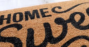 Pan Over Home Sweet Home Welcome Mat with House Key Ring Resting on Floor