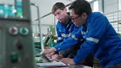 Multiracial Group of Techician male Engineers in uniform are...