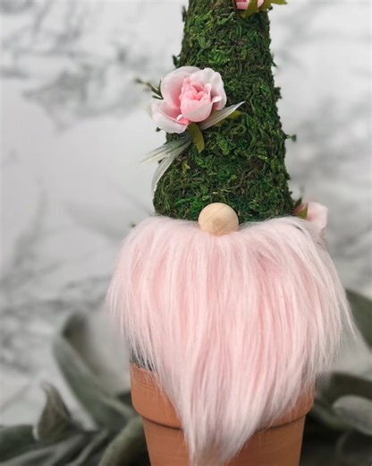 This cutie in a clay pot craft is a fun DIY you can make with a cone, sheet moss, and a clay pot. | Ruffles And Rain Boots