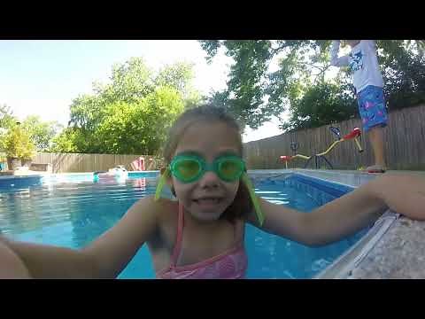 Kids Swimming in a 8 foot pool with a GoPro video camera on a sunny day.
