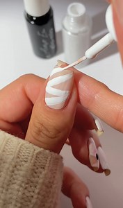 Easy mummy nail art tutorial for Halloween with our NEW Artist Era nail art liners 👀 Colors used: Blank Canvas, Ink-credible, Pirouette @gaby_polish #ellamila #artistera #nailartliners | Ella Mila