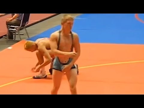 Wrestling in a low cut singlet