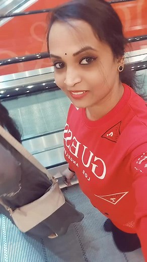 Casual Escalator Ride in Shopping Mall