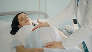 Pregnant Woman Lying On Medical Couch Stock Footage SBV-348476007 - Storyblocks