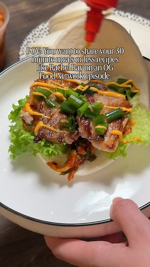 This really only took 10 minutes 🥹 One of my favorite easy weekly dinners. Pan seared pork belly bao buns at home. All you need are frozen lotus leaf buns from your local Asian market, thin sliced pork belly, kimchi, lettuce, and a little green onion with sriracha mayo my favorite store bought is @leekumkeeusa All you have to do is grab a bamboo steamer and steam the buns for eight minutes. Cook the pork belly in a hot pan until it is crispy and golden. Add your toppings and that is it. Two or