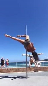 Playing on the Bondi Beach pole yesterday while my friend Yuri does a handstand on the wall behind me. If you watch what's happening in the background it's kind of funny! There's an old man taking photos and a mum stops to show her little girl. Right after we filmed this the mother brought her daughter over and we taught her how to climb. She loved it!