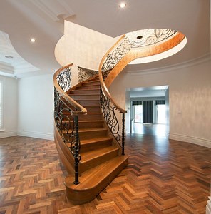 [Hot Item] Solid Wood Curved Staircase Wroght Iron Steel Railing Curved Shape Staircase Metal Spiral Stairs