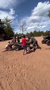 Kids having fun playing tug a war with a four-wheeler | Soggy Bottom Trails