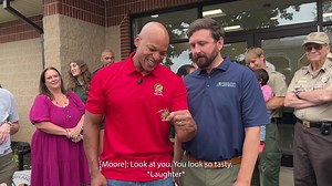 Governor Wes Moore holds a crayfish and names it "Josh", after Maryland DNR Secretary Josh Kurtz. | Maryland Department of Natural Resources