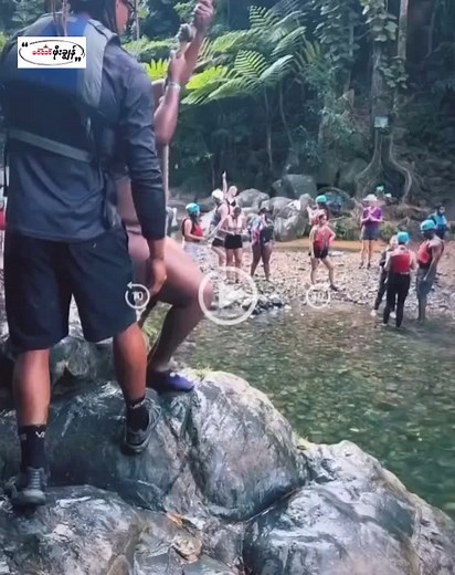 Exciting Rope Swing Adventure at a Scenic Water Spot