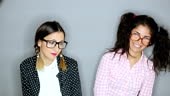 Two silly young nerdy girlfriends, with adorable...