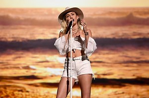 Watch Miley Cyrus Busk in Disguise in a NYC Subway