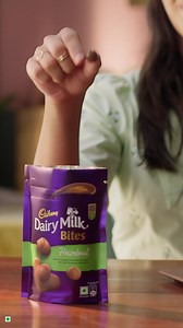 2.9K reactions | Don't you just love it when you get the last slice of that mouth-watering pizza in your gang? 襤 Experience the same wonderful feeling when you bite into a Bite. Introducing Cadbury Dairy Milk Bites – whole roasted nuts coated with delicious Cadbury Dairy Milk Chocolate. The best feeling, in a Bite. . . #CadburyDairyMilkBites #TheBestFeelingInABite #Cadbury #Bites #Chocolate #Pizza | Cadbury Dairy Milk | Facebook