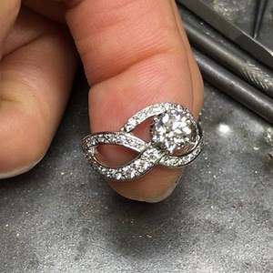 Hand made platinum ring designed to not look like an engagement ring with a symbol to celebrate for the special owner . #cocktailring #jewellerydesign #handmadejewelry #bespoke #jewellery #jeweller #platinium #ring #unique #jeweller #luxury #style #love #diamondring #diamond | McKims Jewellery Design