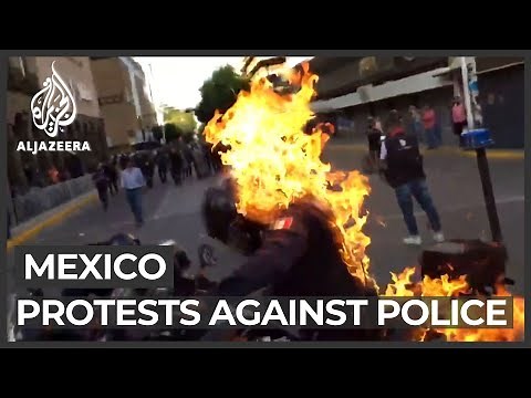 Mexico police set on fire during protests against fatal beating