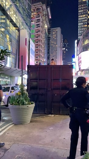 #NYShitty; Disturbing scene in #TimesSquare: A woman, appearing distressed and possibly under the influence, disrobes atop a container while #NYPD officers attempt to safely coax her down amidst a growing crowd.  @3menyc & @espinozastatnyc  - @TheIvyBoatBand - “IMY but Here’s the Thing” * uncensored clip on our Twitter/X account : @NewYorkShittyNews Via @ontodaysnewyorkshitty for more! | The Myxs | Facebook