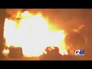 Lawn mower fire ignites inside garage of Coventry home