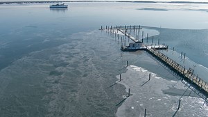 Nantucket bound ferries cut through thin sea ice heading from Hyannis