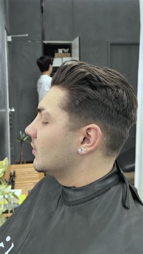 A modern quiff with a low fade, built through restraint, balance, and precise execution. The sides are kept clean with a soft, controlled transition, while the top retains structure and movement for a timeless, wearable finish. Finished with sharp outlining and razor detailing to refine the edges without overpowering the shape. This is a restyle focused on longevity and clarity, where every step serves the final form rather than visual noise. Crafted at Ikigai Barbers, Melbourne CBD. #IkigaiBarb