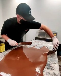 315K views · 867 reactions | Working in a chocolate factory looks like the most delicious job going - that chocolate 'river' though!  | LADbible | Facebook