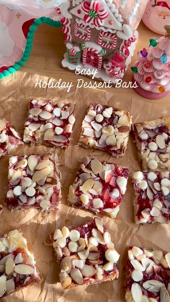✨ RASPBERRY COCONUT MAGIC BARS✨ ✨ Magic bars, aka 7-layer bars, are a vintage bake from my childhood. This is my holiday raspberry version. I updated it a bit since I first posted it 2 yrs ago ✨ Perfect for an easy, last minute holiday treat that feeds a crowd. It always turns out delicious! You can also switch up the white chocolate chips for dark chocolate chips if you like 🎄 RECIPE 2 cups (185g) graham cracker crumbs (about 25 squares) 1/2 cup plus 2 tbs (142g) salted butter, melted 3 cups (