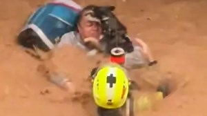 Moment terrified Spanish woman & pet dog are airlifted from deadly floodwater