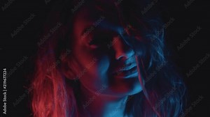 Portrait of beautiful young woman modelling in studio photo shoot (slow motion)