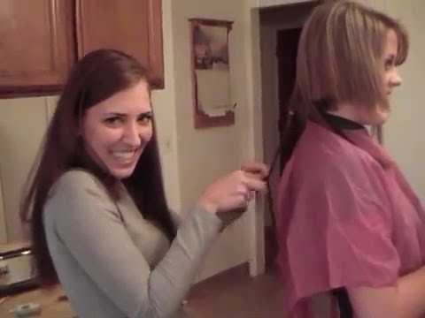 TWO GIRLS CUTTING EACH OTHERS HAIR