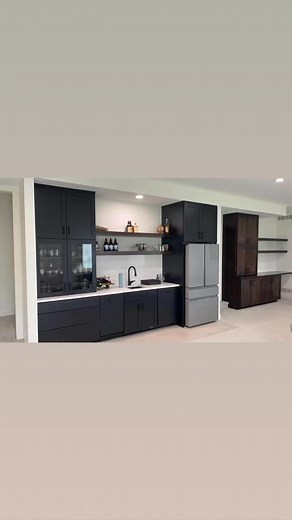 Beautiful custom basement bar, desk nook and vanity. Matte Black finish and Dark Roast stain. Installed in Waukee. | Clear Image Cabinetry & Construction