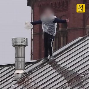 The prisoner could be seen clambering along the roof of the jail wearing a makeshift waterproof | Manchester Evening News