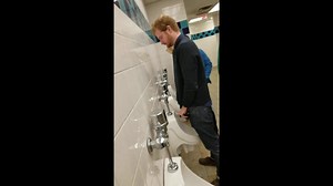 MANY MEN PISSING AT URINAL 5